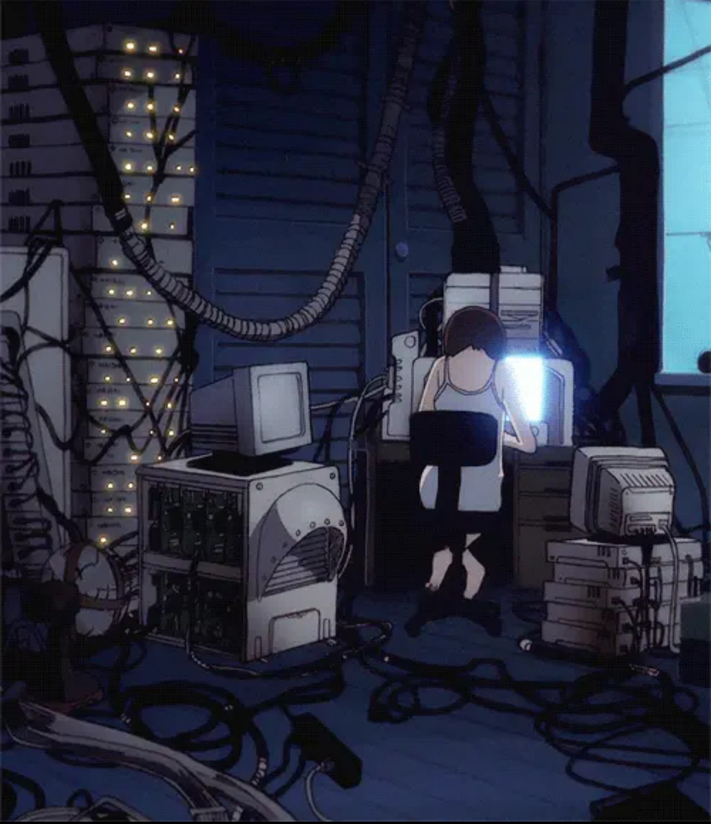 The meme is an image of a person sitting in a dark, cluttered room filled with old computers and wires. The text "I can smell the desperation in the air" is overlaid on the image, implying that the person is struggling to cope with their situation. The image is a humorous commentary on the struggles of being a computer enthusiast or gamer.